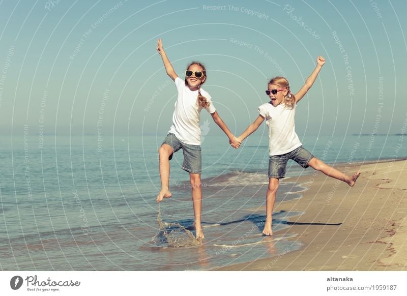 two sisters playing on the beach Lifestyle Joy Happy Beautiful Relaxation Leisure and hobbies Playing Vacation & Travel Freedom Summer Sun Beach Ocean Success