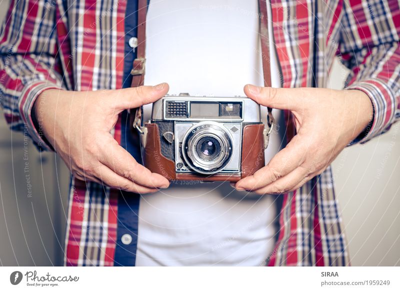 old camera Camera Masculine Man Adults Hand 1 Human being 45 - 60 years T-shirt Shirt To hold on Old Ancient Antique Retro Colour photo Interior shot Close-up