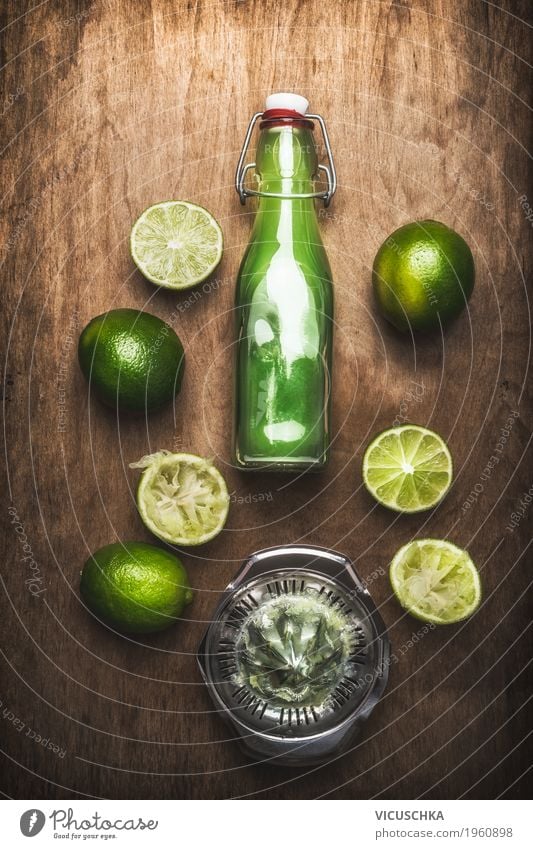 Lime juice in bottle with fruits and juicer Food Fruit Nutrition Organic produce Vegetarian diet Diet Beverage Juice Crockery Bottle Style Design Healthy Eating