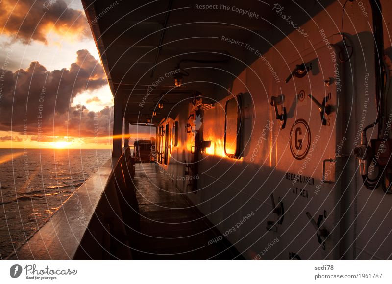 ship side of vessel during sunset at sea Nature Landscape Water Sky Cloudless sky Clouds Sunrise Sunset Beautiful weather North Sea Ocean Transport Navigation