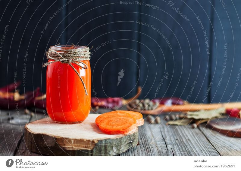 Jar of fresh carrot juice on a wooden surface Vegetable Herbs and spices Nutrition Vegetarian diet Diet Beverage Cold drink Juice Bottle Healthy Eating Table