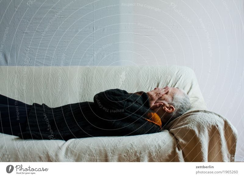 Man lies on his back and on a couch Bed Couch Lie Sofa Human being Sleep Siesta Rest Copy Space Bolster Blanket White Grief Sadness Head Hand Cold Hide Ignorant
