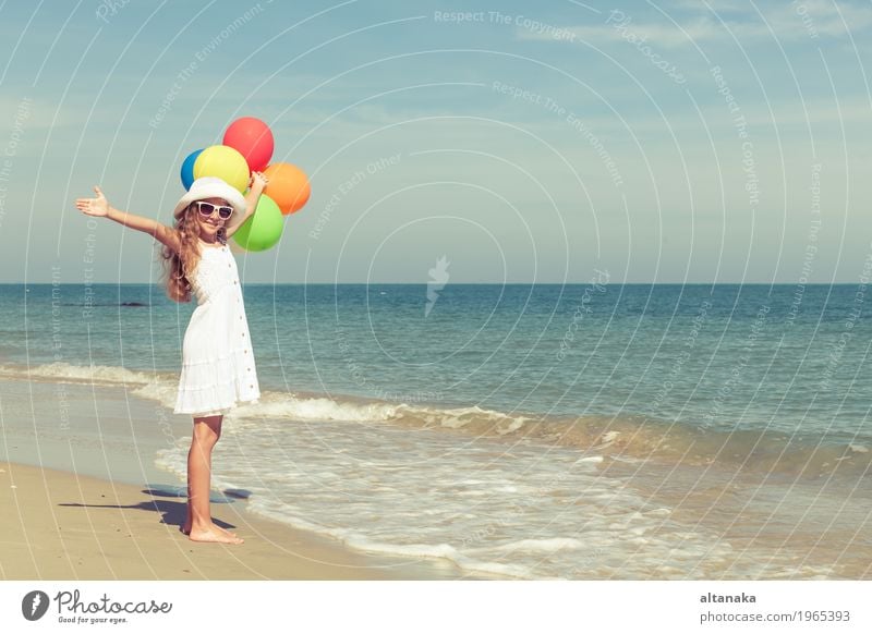 Teen girl with balloons standing on the beach Lifestyle Joy Happy Relaxation Leisure and hobbies Playing Vacation & Travel Trip Adventure Freedom Summer Sun
