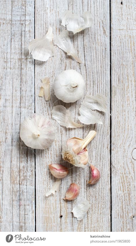 Organic garlic on the old wooden table top view Vegetable Herbs and spices Vegetarian diet Table Old Fresh Gray White Decline bulb Clove food Garlic healthy