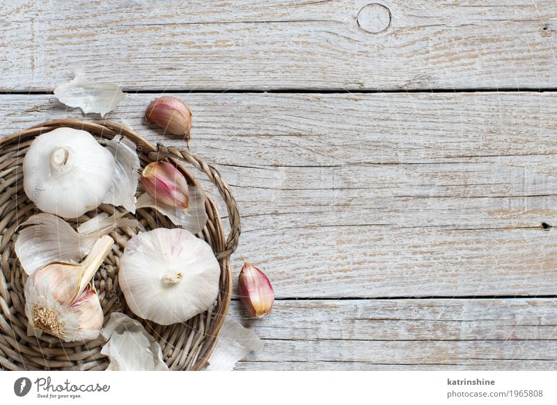 Organic garlic on the old wooden table top view Vegetable Herbs and spices Vegetarian diet Table Old Fresh Gray White Decline bulb Clove food Garlic healthy
