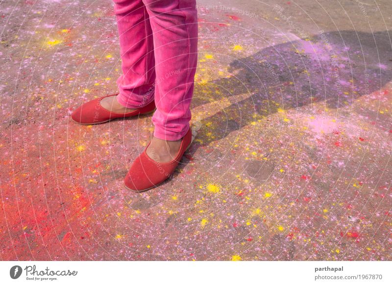 Girl with red shoe, colorful background Red shoe Concrete Pink Color powder Holi Stand Colour photo Multicoloured Exterior shot Close-up
