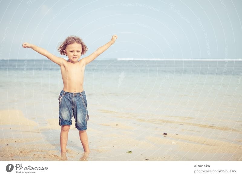 Portrait of little boy standing on the beach Lifestyle Joy Happy Relaxation Leisure and hobbies Playing Vacation & Travel Trip Adventure Freedom Summer Sun