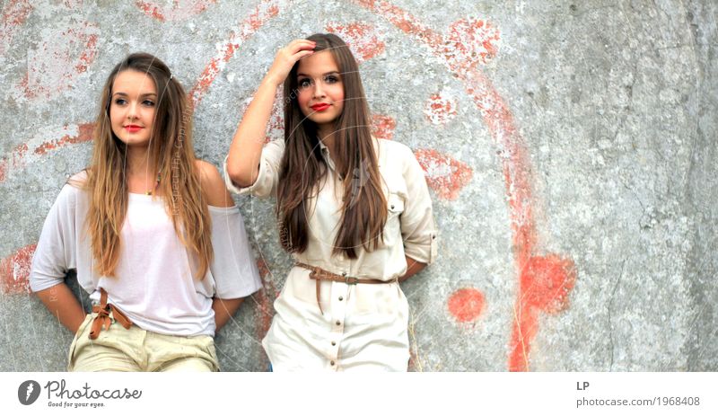 2 beautiful girls standing against a wall Lifestyle Elegant Style Design Beautiful Hair and hairstyles Human being Feminine Young woman Youth (Young adults)