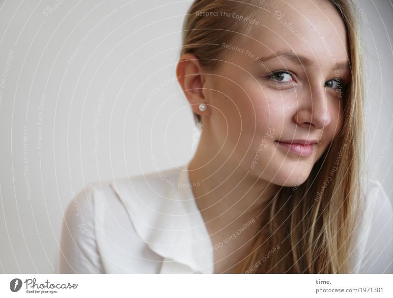 . Feminine Young woman Youth (Young adults) 1 Human being Shirt Jewellery Earring Blonde Long-haired Observe Think Smiling Looking Wait Curiosity Positive