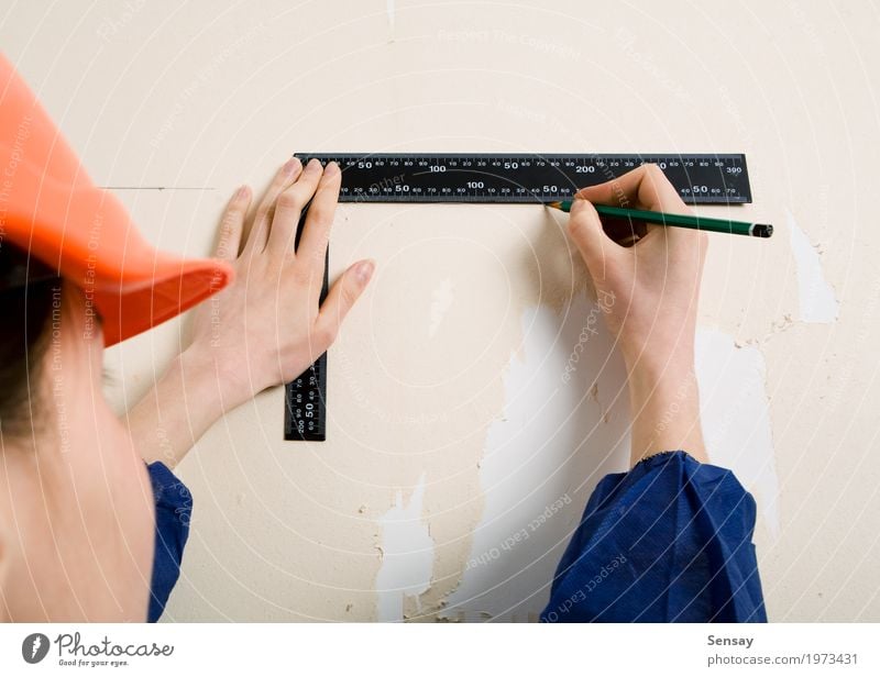 Worker with corner and pencil in hand Decoration Wallpaper Work and employment Craftsperson Tool Woman Adults Hand Gloves Paper Old Blue Protection Home