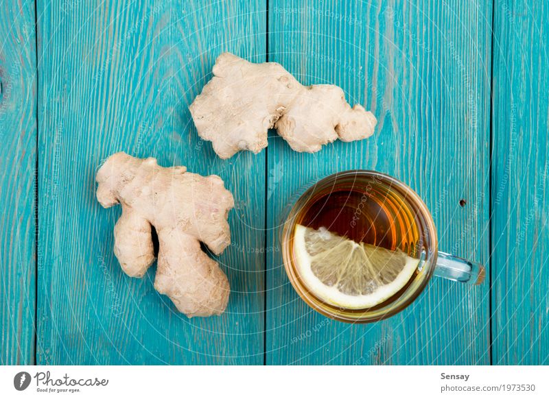 Ginger tea in a cup on wooden background Vegetable Tea Alternative medicine Life Table Wood Fresh Hot Natural ginger Aromatic care drink flavoring glass healthy