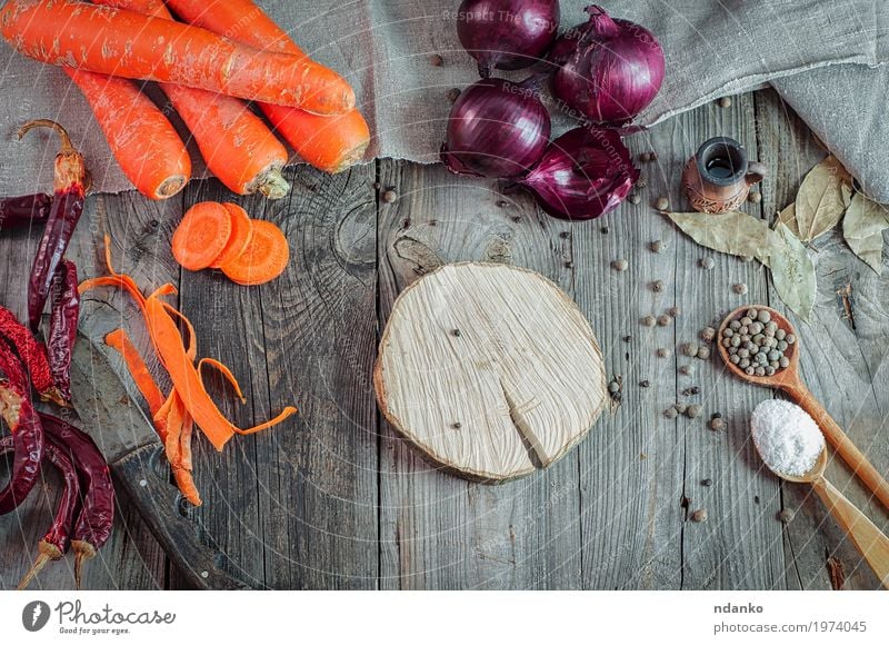 Fresh carrots and onions on a gray wooden table Food Vegetable Herbs and spices Eating Breakfast Vegetarian diet Diet Juice Spoon Table Kitchen Wood Natural