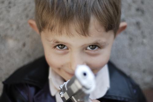 barrel of gun Human being Child Boy (child) Head Face Eyes 1 3 - 8 years Infancy Blonde Small Toys Handgun Looking into the camera Children's game