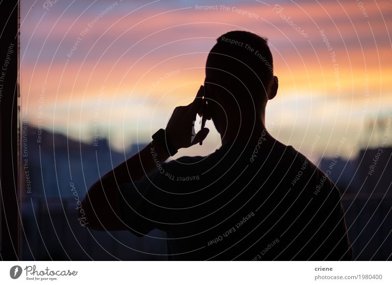 Silhouette of young man on the phone Telecommunications Business Meeting To talk Telephone Cellphone PDA Technology Entertainment electronics Masculine