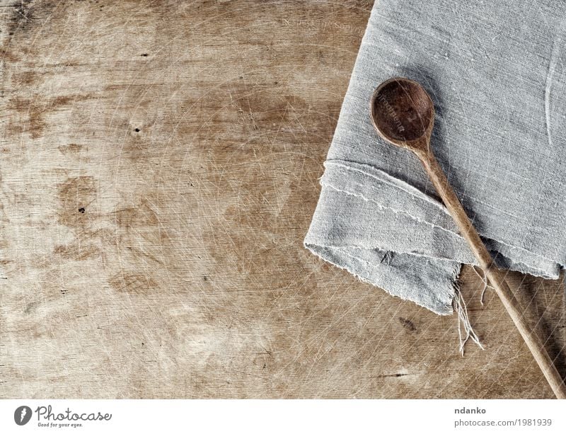 Brown wooden background with a wooden spoon Spoon Table Kitchen Wood Old Above Gray cook board empty space Shabby housewares Home textile napkin Tablecloth