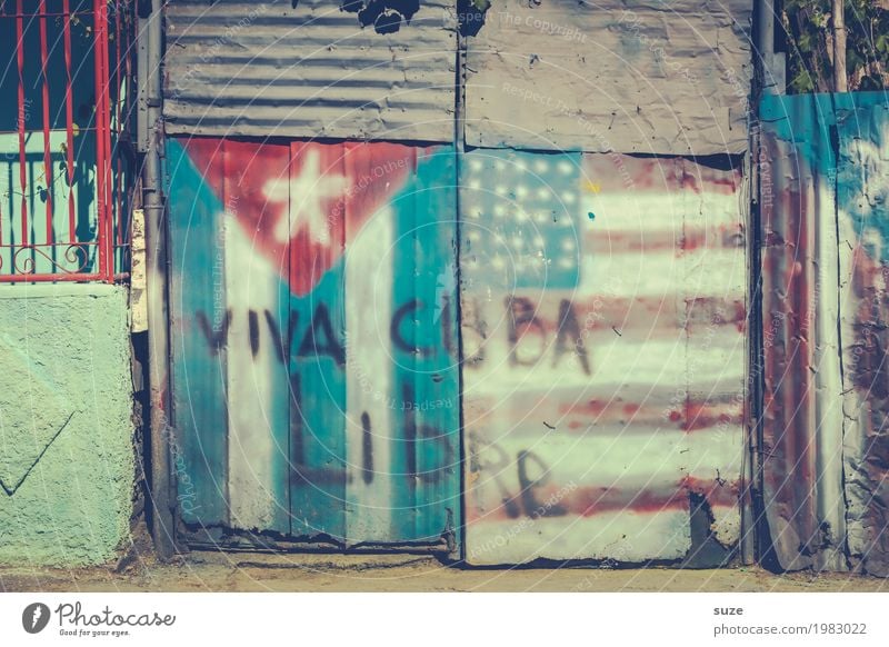 Genuine Cuba Freedom City trip Culture Warmth Outskirts Hut Gate Sign Graffiti Flag Old Poverty Dirty Broken Rebellious Retro Pride Decline Past Transience