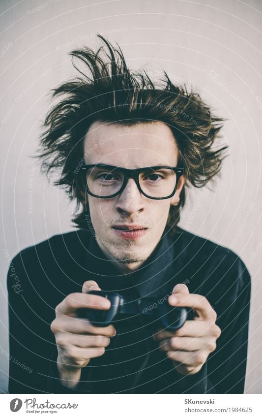 Young nerd playing video games Joy Leisure and hobbies Playing Entertainment Games console Technology Entertainment electronics High-tech Human being Man Adults