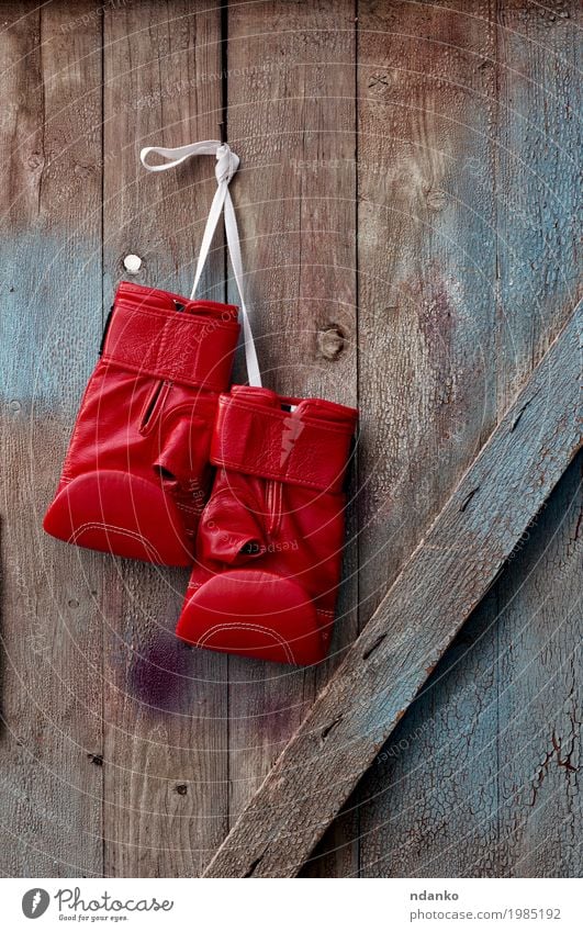 pair of red leather boxing gloves hanging on a nail Sports Success Loser Rope Leather Gloves Wood Old Hang Retro Blue Red Competition Object photography Kick