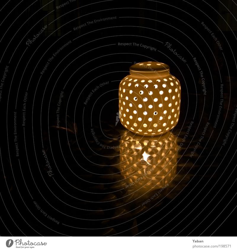 There is a light ... Design Living or residing Decoration Lamp Balcony Candle Illuminate Round Warmth Contentment Night shot Night life Dark Colour photo