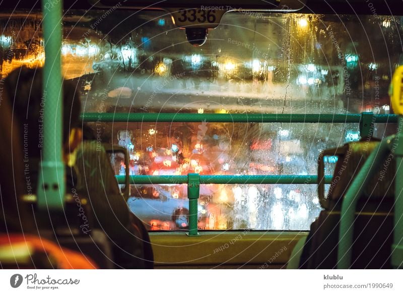 Wet with rain street through the glass of the bus. Life Vacation & Travel Weather Rain Transport Street Vehicle Movement Modern Vantage point sign Illuminate