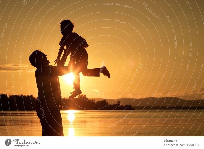 Father and son playing at the sunset time. Lifestyle Joy Happy Leisure and hobbies Vacation & Travel Adventure Freedom Camping Summer Sun Beach Mountain Hiking