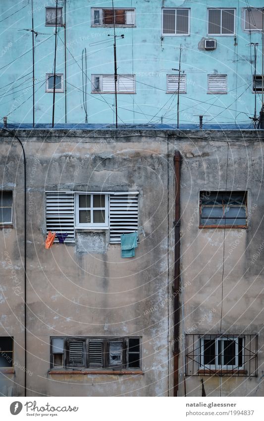 clothesline Capital city Downtown High-rise Wall (barrier) Wall (building) Facade Window Poverty Simple Blue Orange Colour photo Exterior shot Copy Space bottom