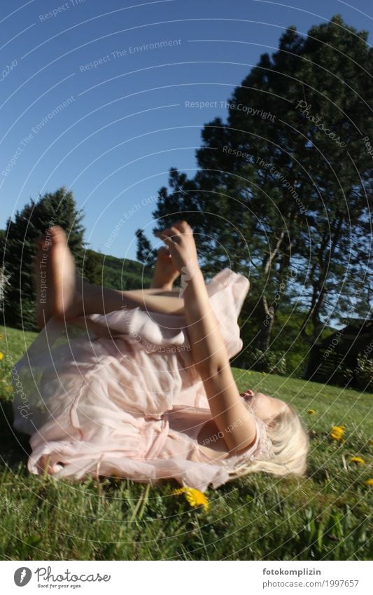 Girl in bright dress tumbling on a green summer meadow Child Infancy Joie de vivre (Vitality) Romp 8 - 13 years Movement Nature Spring Summer Garden Park Meadow