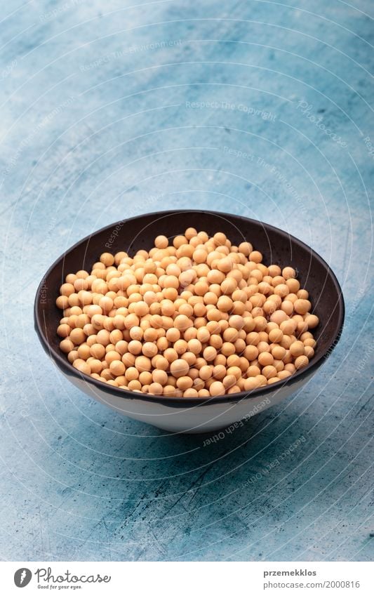 Soy beans in a bowl on table Grain Nutrition Organic produce Vegetarian diet Bowl Fresh Natural Beans Fiber food healthy Ingredients Protein Raw seed