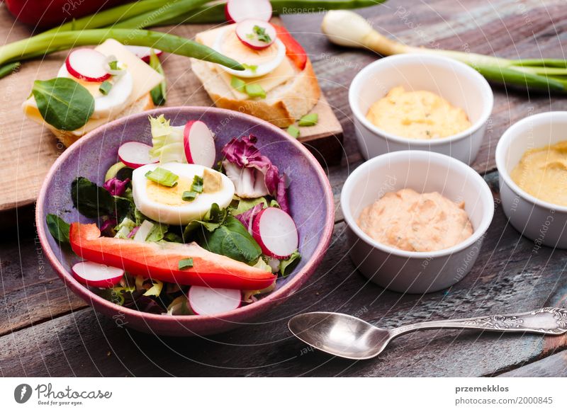 Healthy meal with eggs and vegetables Food Vegetable Lettuce Salad Bread Lunch Vegetarian diet Diet Bowl Healthy Eating Table Wood Fresh Delicious Meal mustard