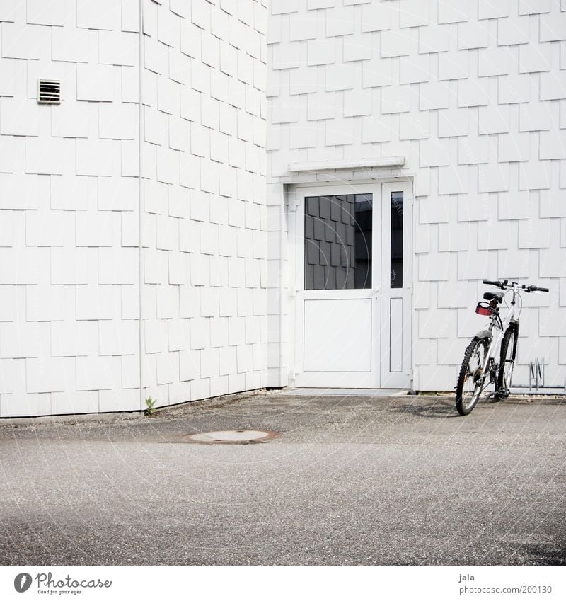 bike rack House (Residential Structure) Places Manmade structures Building Architecture Facade Door Bicycle Bicycle rack Clean White Arrangement Simple Puristic