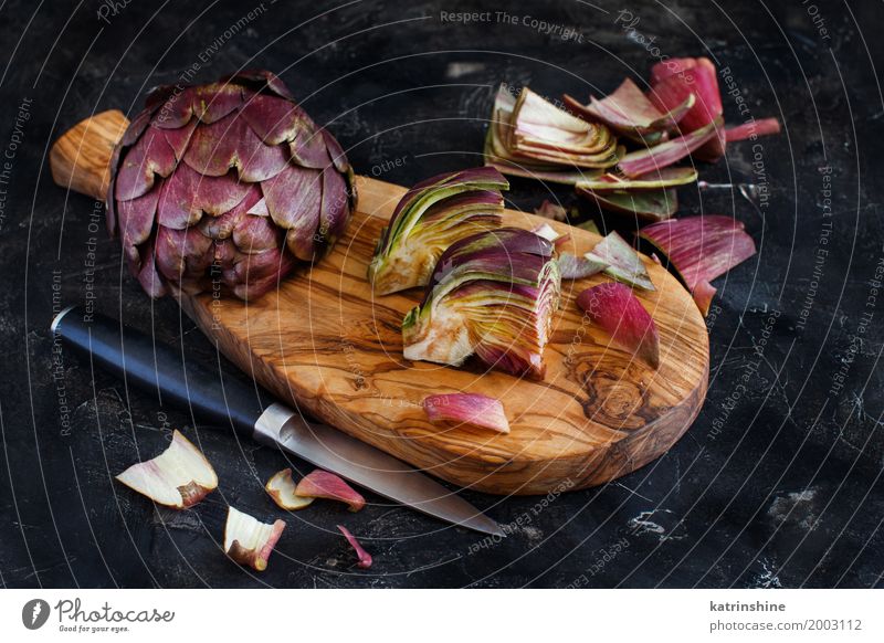 Roman Artichokes on a wooden board with knife Vegetable Nutrition Vegetarian diet Italian Food Knives Fresh Gray Green agriculture Purple cooking Cut Edible