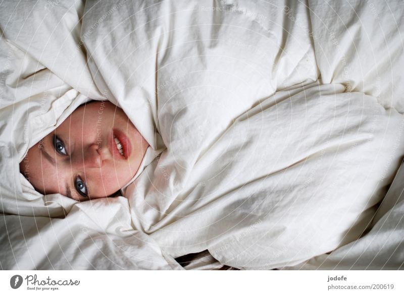face show Human being Feminine Young woman Youth (Young adults) Woman Adults Face 1 18 - 30 years Lie White Duvet Hide Wrapped in Cozy Hidden Head Colour photo