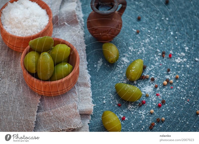 Green olives and olive oil in a clay pitcher Food Vegetable Nutrition Vegetarian diet Diet Bowl Wood Fresh Natural Above Black White Italian ripe Berries