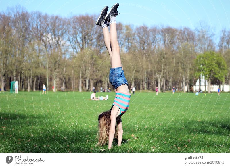 Handstand in april | girl does sport in the park Joy Leisure and hobbies Playing Summer Sports Fitness Sports Training Gymnastics Yoga Child Girl Young woman