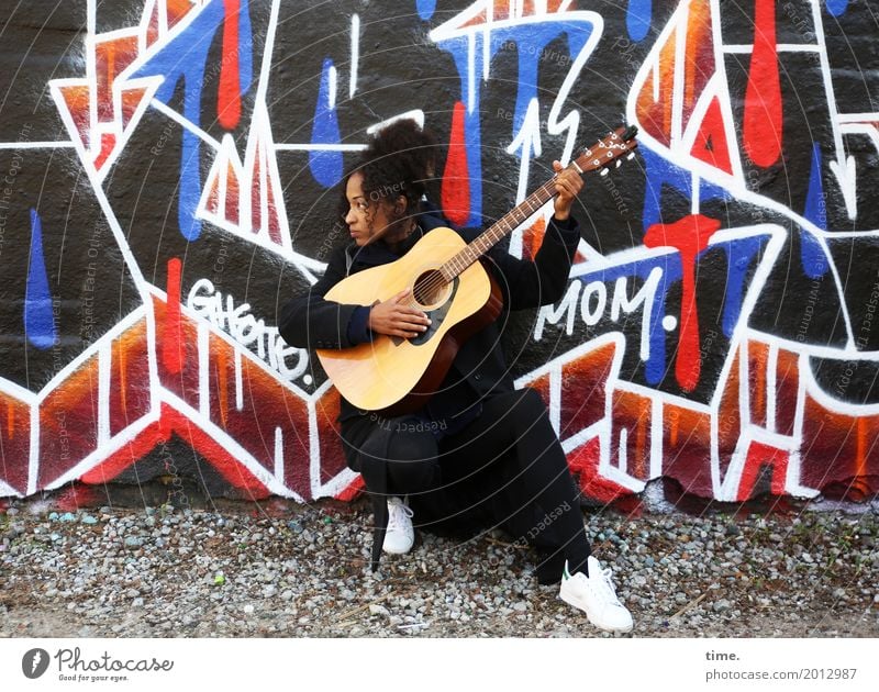 Music Ghetto Mom Feminine Woman Adults 1 Human being Artist Concert Musician Guitar Wall (barrier) Wall (building) Lanes & trails Coat Sneakers