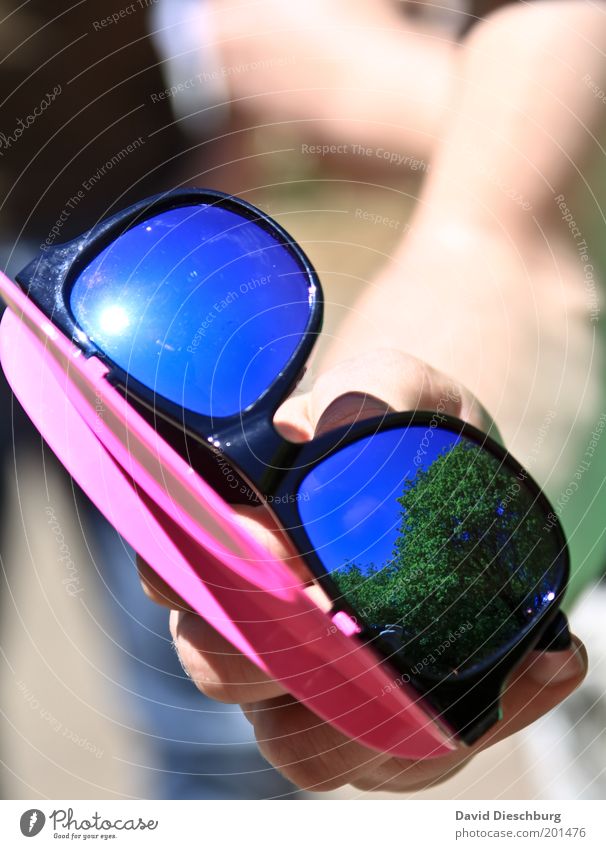 Best sun-glasses ever Summer Beautiful weather Warmth UV radiation Sunglasses To hold on Plastic Weather protection Hand Extravagant Colour photo Exterior shot