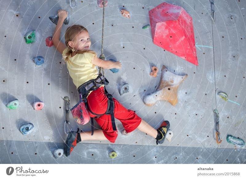 little girl climbing a rock wall indoor Joy Leisure and hobbies Playing Vacation & Travel Adventure Entertainment Sports Climbing Mountaineering Child Rope