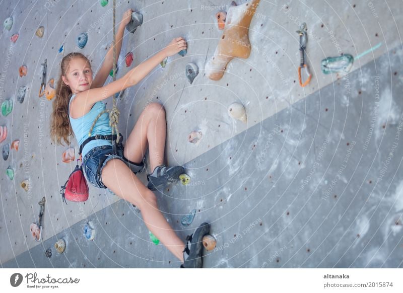 teenager climbing a rock wall Joy Leisure and hobbies Playing Vacation & Travel Adventure Entertainment Sports Climbing Mountaineering Child Rope Human being