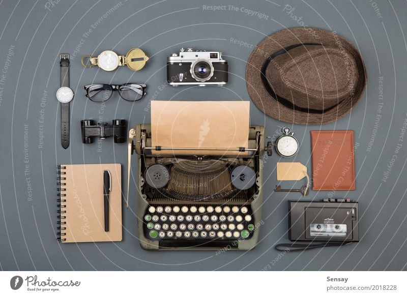 Journalist or private detective workplace Desk Table Workplace Office Newspaper Magazine Book Hat Paper Binoculars Old Observe Write Retro Black Typewriter
