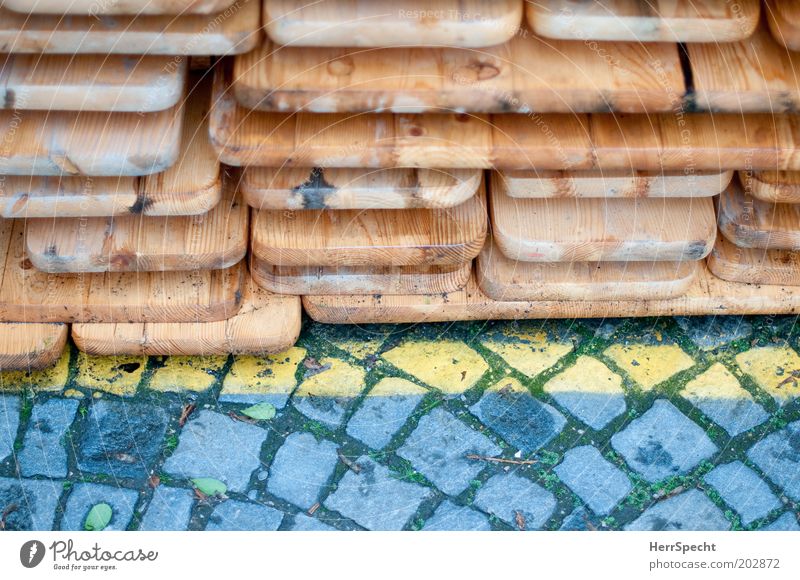 deposit Brown Yellow Gray Paving stone Line Ale bench Beer table Stack Wood Colour photo Subdued colour Exterior shot Close-up Detail Copy Space bottom Day