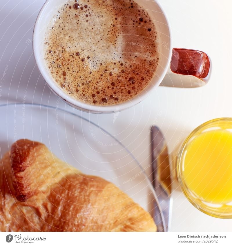 Coffee, croissant, juice Food Orange Dough Baked goods Croissant Nutrition Breakfast Beverage Hot drink Juice Plate Cup Glass Knives Fluid Friendliness Healthy