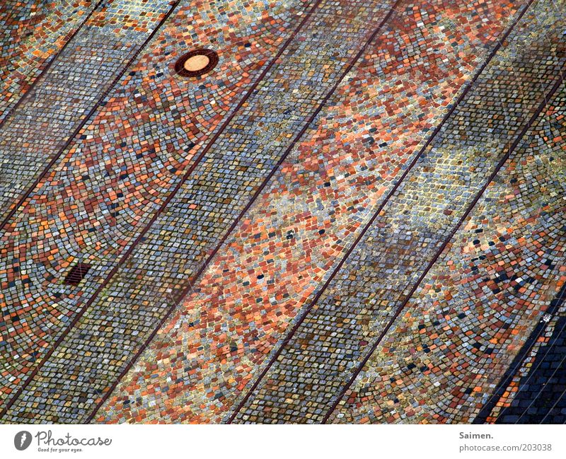 cobblestone paved street Traffic infrastructure Street Lanes & trails Rail transport Railroad crossing Gully Cobblestones Railroad tracks Stone Colour photo