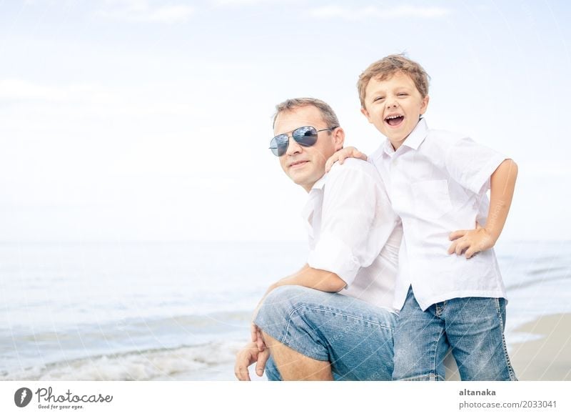 Father and son playing on the beach Lifestyle Joy Relaxation Leisure and hobbies Playing Vacation & Travel Trip Freedom Summer Sun Beach Ocean Child School