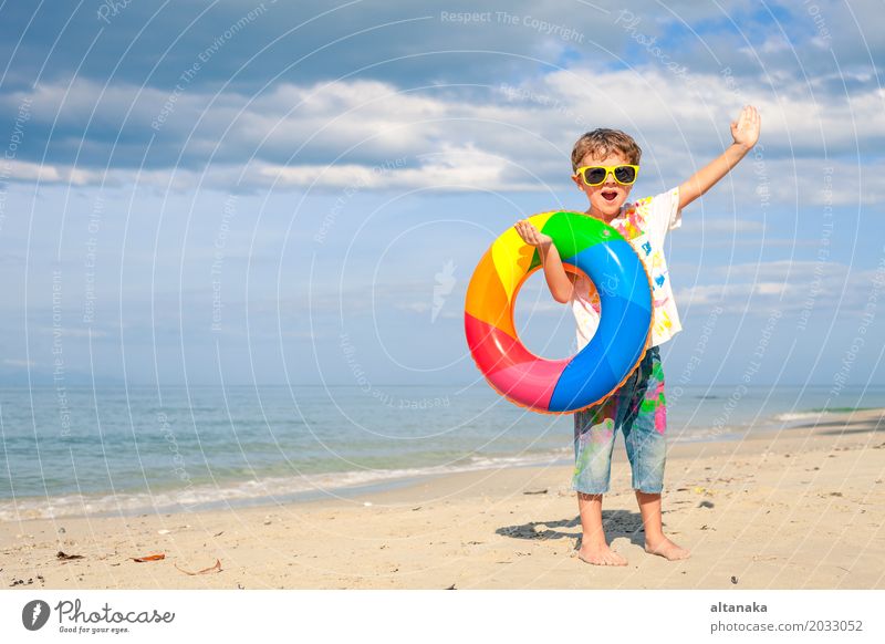 Little boy with rubber ring Lifestyle Joy Happy Relaxation Leisure and hobbies Playing Vacation & Travel Trip Adventure Freedom Summer Sun Beach Ocean Child