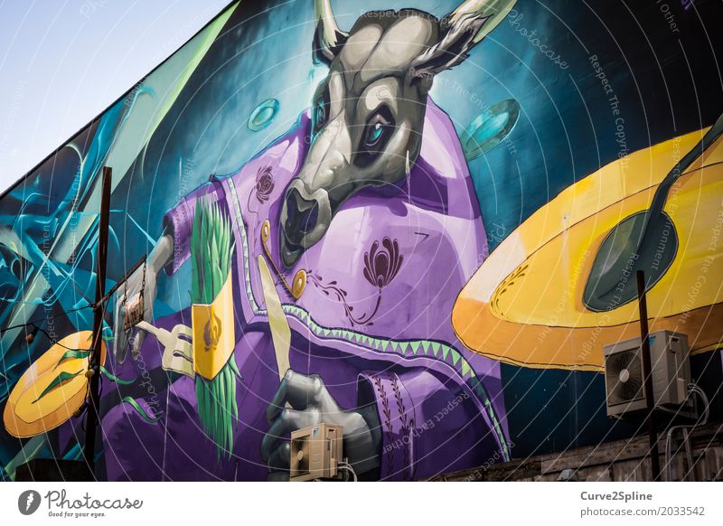 Street Art Taurus Cool (slang) Graffiti Street art Bull Eating Vegetable Animal Multicoloured Violet Asparagus Cutlery Cape Blue Turquoise Yellow