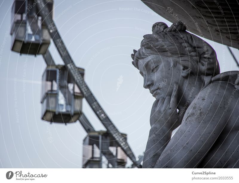 Eye of Budapest Sculpture Art Angel Statue Ferris wheel Hungary Europe Woman Town Driver's cab Blue Gray Downtown eye of budapest Perspective Philosopher Stone