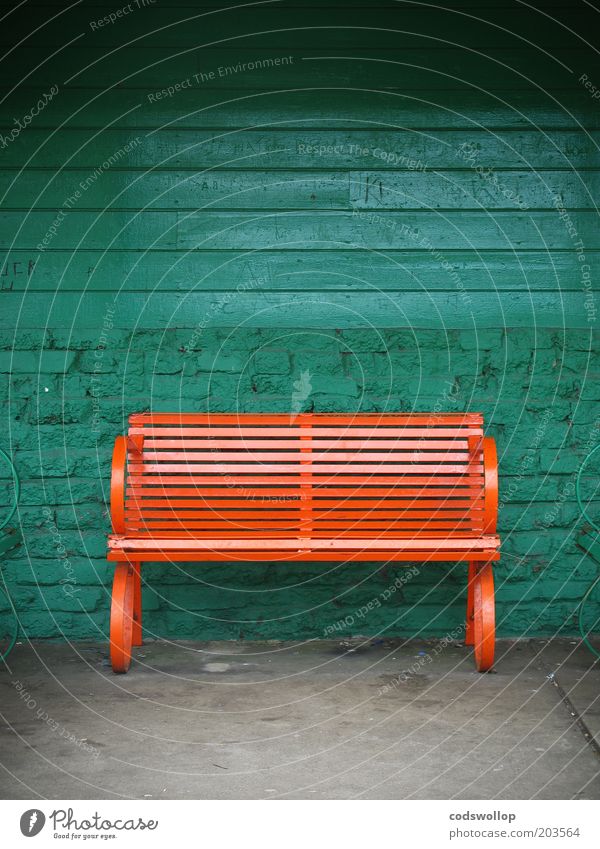 two-seater Wall (barrier) Wall (building) Bench Esthetic Green Orange Bus stop Colour photo Exterior shot Copy Space top Day Deserted