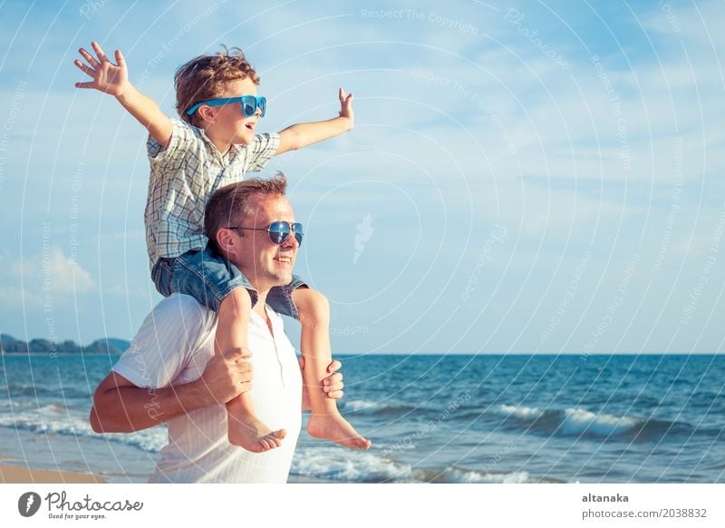 Father and son playing on the beach at the day time. Lifestyle Joy Relaxation Leisure and hobbies Playing Vacation & Travel Trip Adventure Freedom Summer Sun