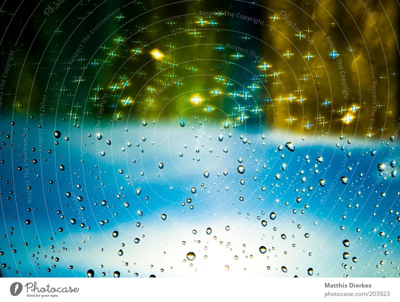 rain Window Window pane Glittering Drops of water Blue Blue sky Gold Colour photo Interior shot Copy Space bottom Copy Space middle Day Light Shadow Contrast