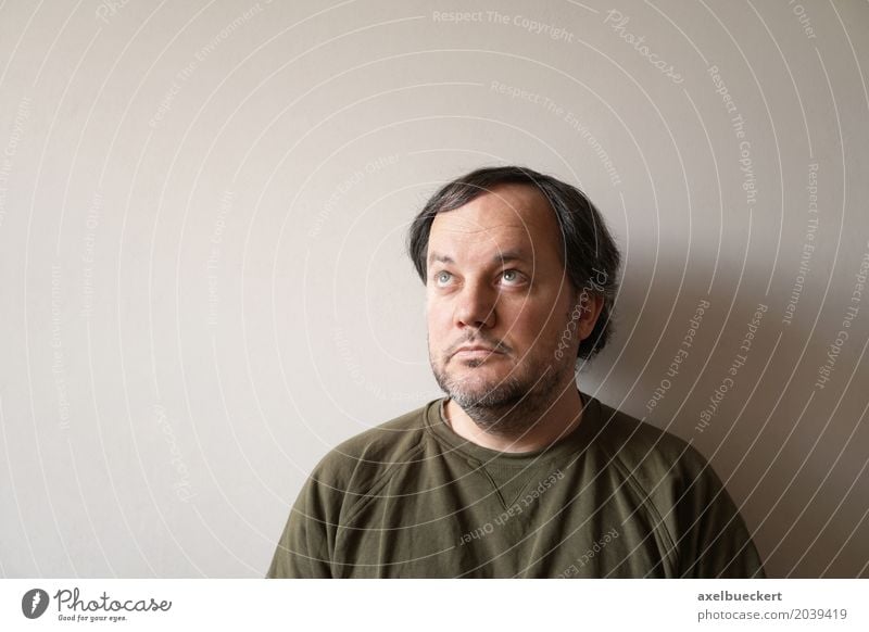 Man looking up, with space for text Human being Masculine Adults 1 30 - 45 years 45 - 60 years Wall (barrier) Wall (building) Black-haired Facial hair